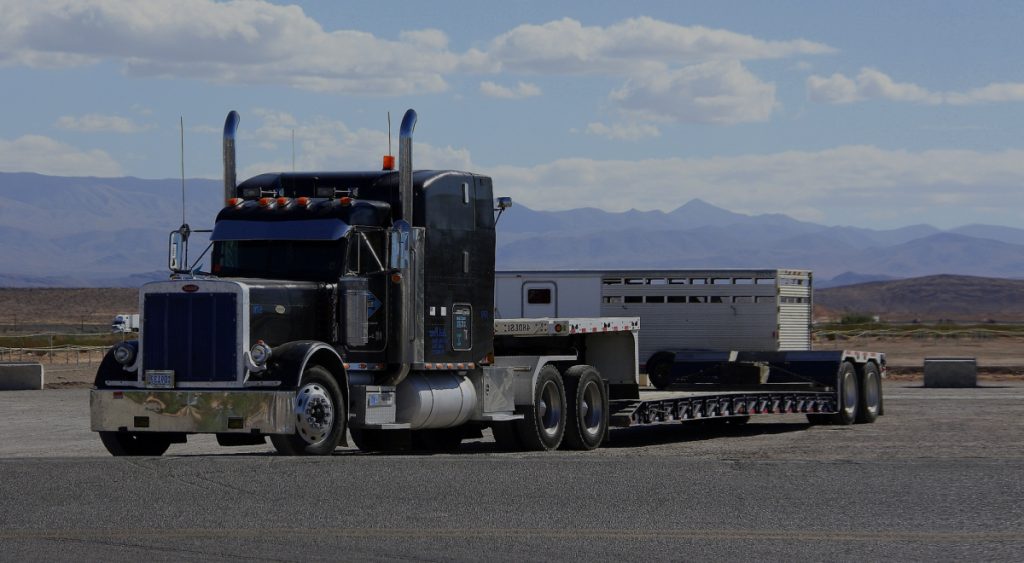 Flatbed truck used to ship freight that is tall