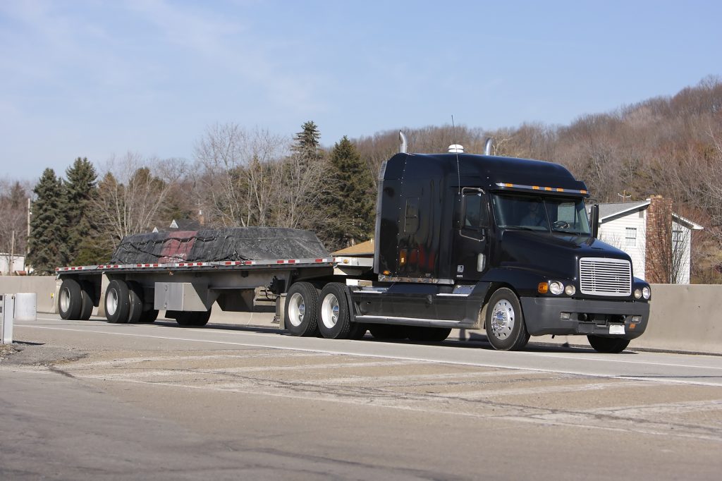 Flatbed delivering freight on Atlanta, Georgia highway